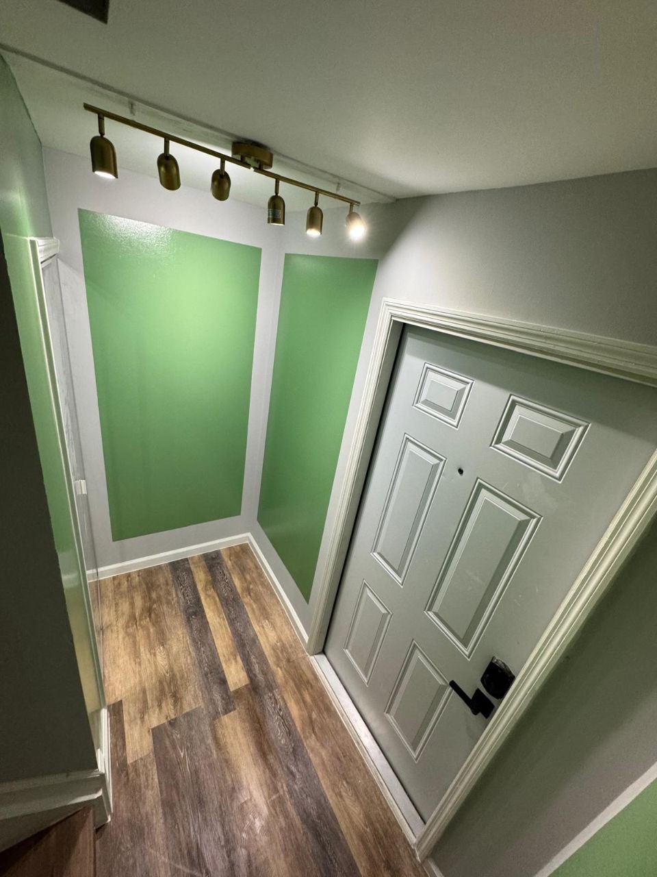 Interior hallway repaint with green accent wall