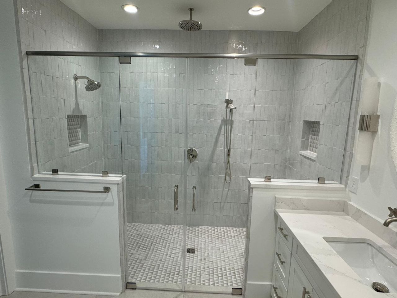 Master bathroom glass shower with mosaic floor